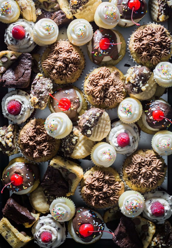 selection of chocolate cupcakes, fairy cakes and chocolate treats laid out in image